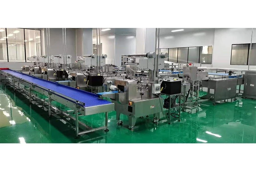 flower cake automatic feeding packaging line caramel treats automatic packing line machine manufacturer China supplier